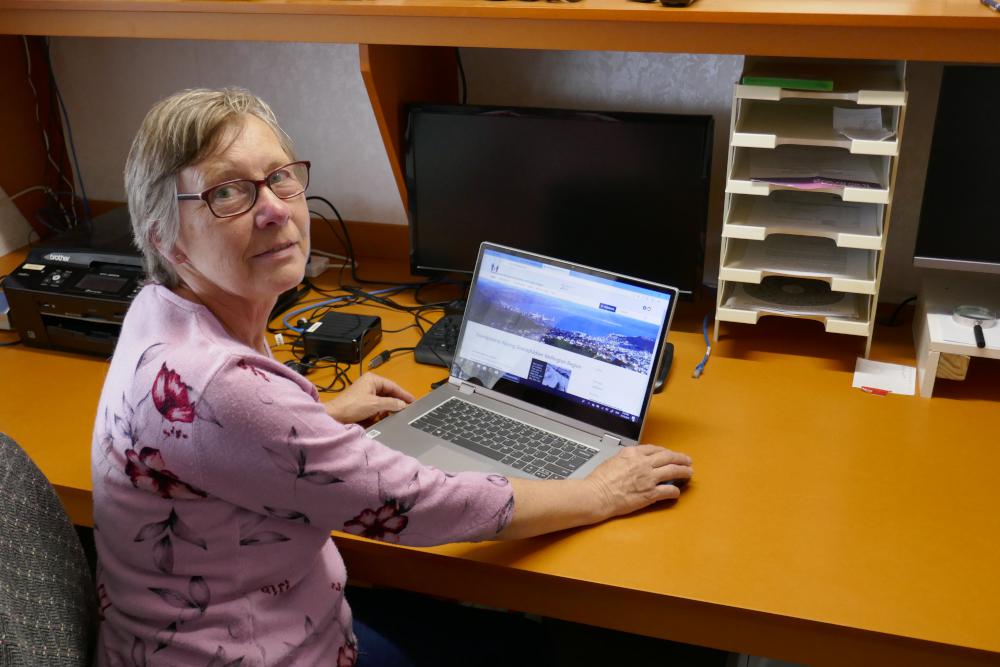 Maria behind laptop